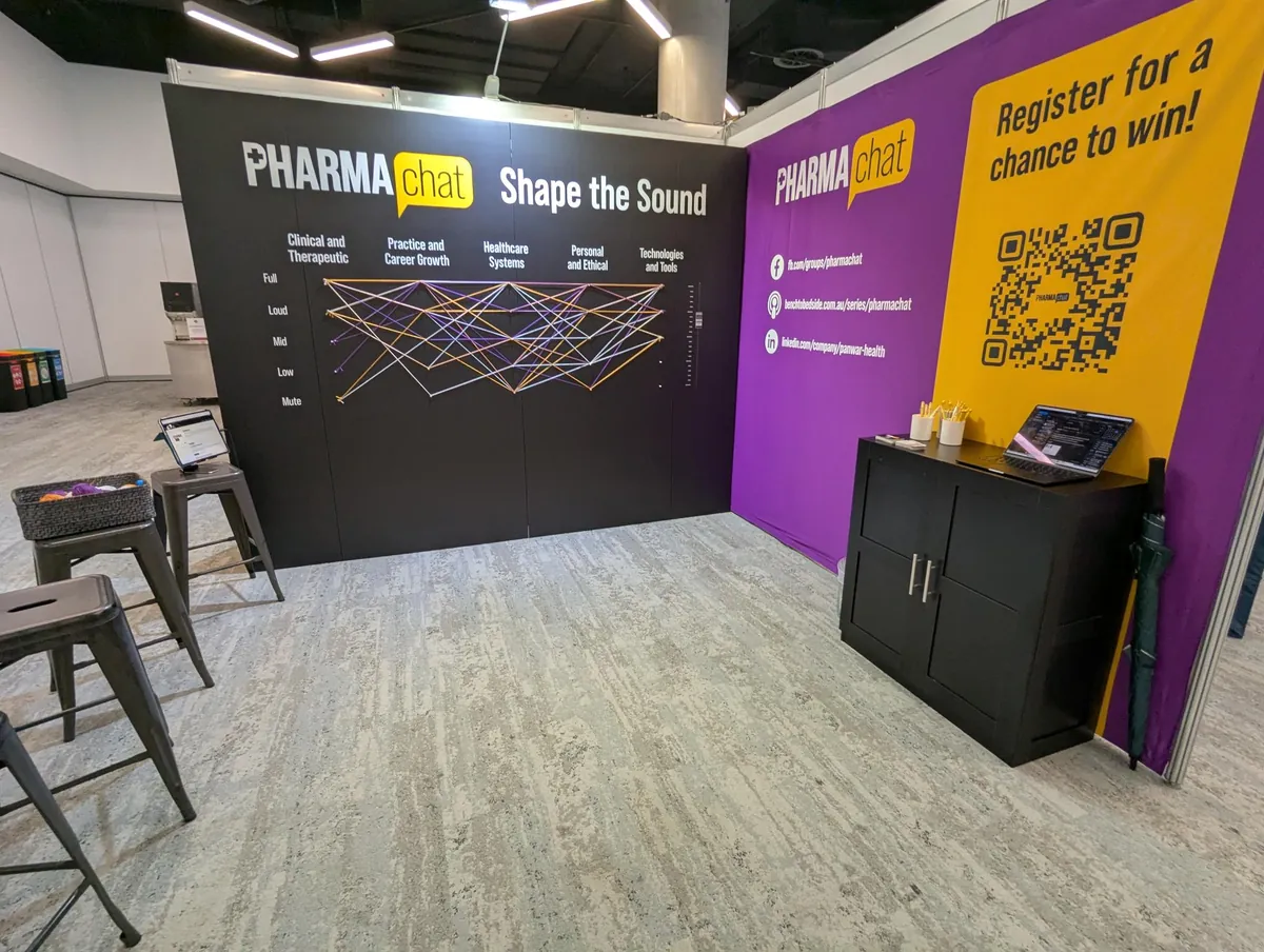 Exhibition stand with string art feature wall and registration area